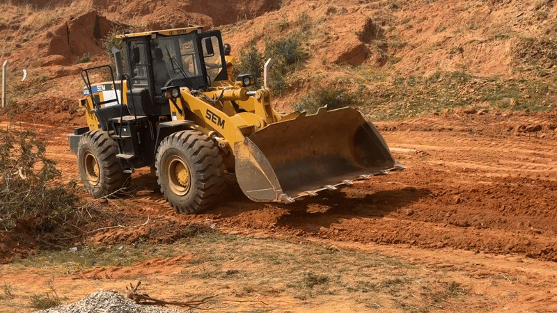 Construction crew operates wheel loader in Bar Gada, Nigeria