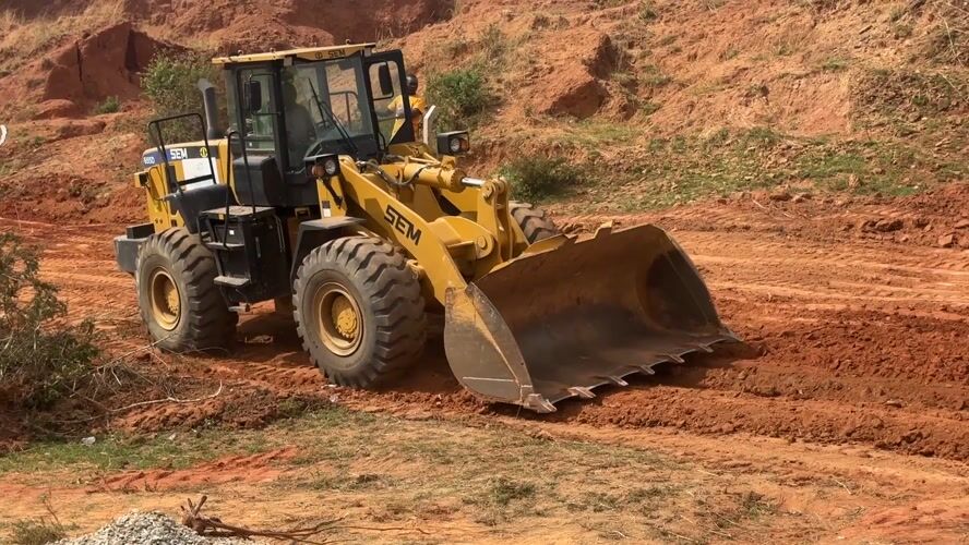 Construction crew operates wheel loader in Bar Gada, Nigeria