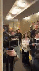 Crowd gathers in Kyiv public building lobby