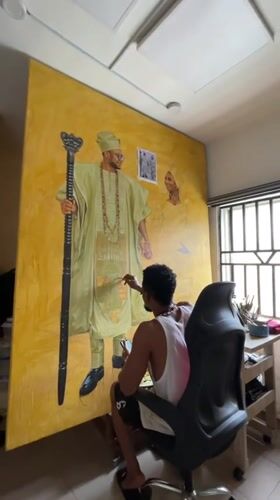 Artist at work on a large traditional portrait in Ado, Nigeria