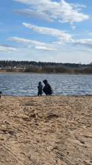 Families enjoy afternoon lakeside recreation in Литвиново, Russia