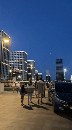 Evening stroll captured in Kazan amid illuminated cityscape