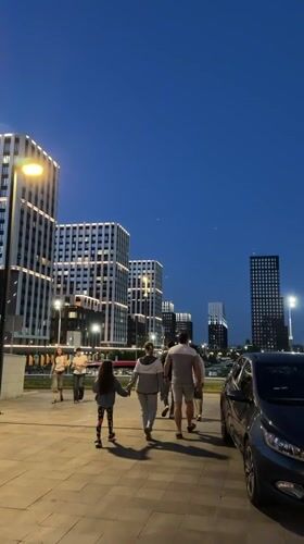 Evening stroll captured in Kazan amid illuminated cityscape