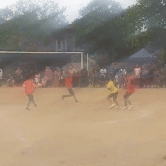 Pickup soccer match on a dirt field in Cibalong, Indonesia