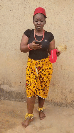 Woman in traditional Igbo dress documented across Onitsha area