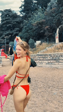Woman in red bikini observed on Montenegro beach