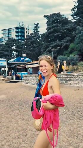 Woman in red bikini observed on Montenegro beach