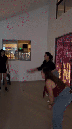Young people celebrate with confetti, balloons in Arica house party