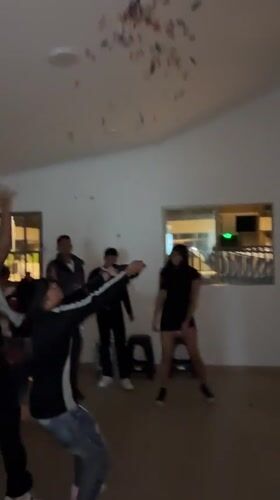 Young people celebrate with confetti, balloons in Arica house party