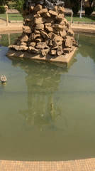 Bronze statue and landscaped park documented in Gwong, Nigeria