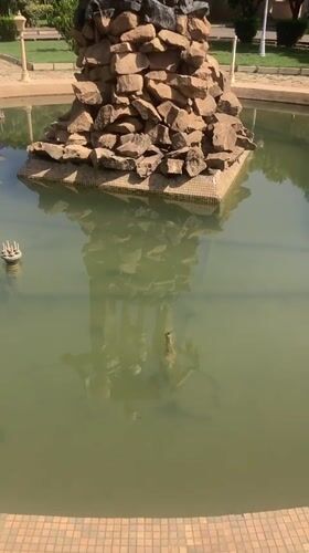 Bronze statue and landscaped park documented in Gwong, Nigeria