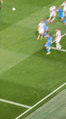 High-angle view of a soccer match near the penalty box