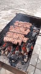 Outdoor barbecue gathering with wine and grilled meat documented