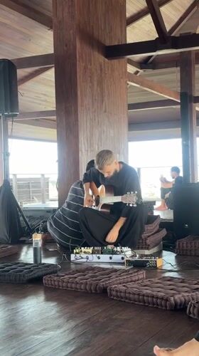 Musicians perform dawn concert in wooden pavilion, Mengwi Indonesia