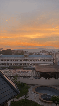 Sunset captured over Ratsada cityscape in Thailand