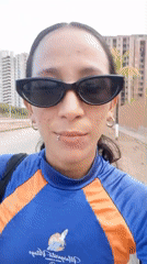 Woman films smartphone selfies on Porlamar street