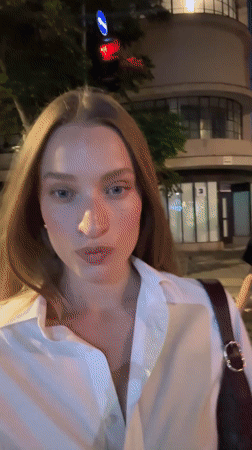 Evening street scenes featuring young women documented in Tel Aviv