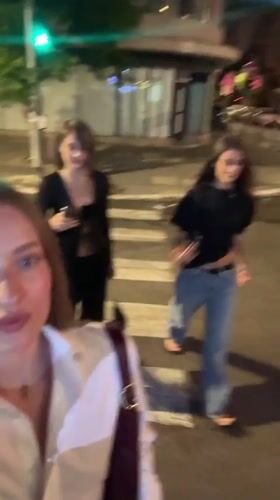 Evening street scenes featuring young women documented in Tel Aviv