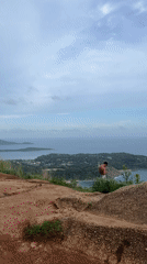 Tourists gather at Karon hilltop viewpoint for ocean views