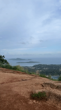 Tourists gather at Karon hilltop viewpoint for ocean views