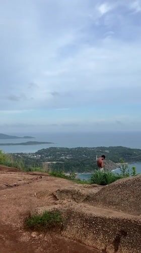 Tourists gather at Karon hilltop viewpoint for ocean views