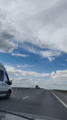 Highway drive through rural Ukraine on a clear June day