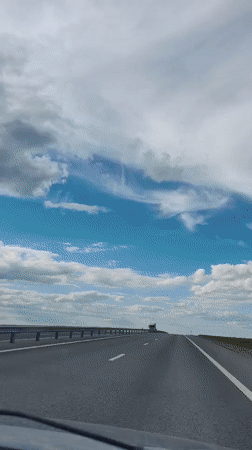 Highway drive through rural Ukraine on a clear June day