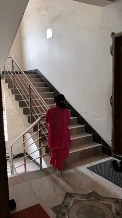 Playful moments in a pink embroidered dress, Dhaka interior