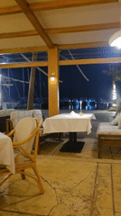 Outdoor restaurant dining captured in nighttime Hurghada scene