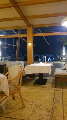 Outdoor restaurant dining captured in nighttime Hurghada scene