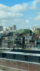 Elevated views captured of Buenos Aires during partly cloudy afternoon