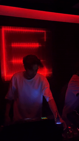 DJ performs at red-lit Tel Aviv club