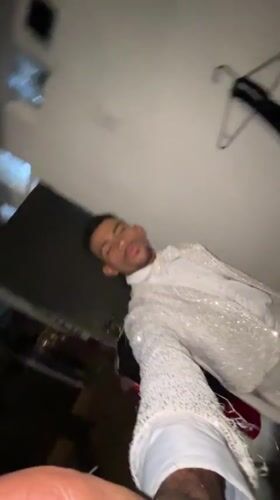 Coordinated performers in sequined white outfits documented in Porlamar venue