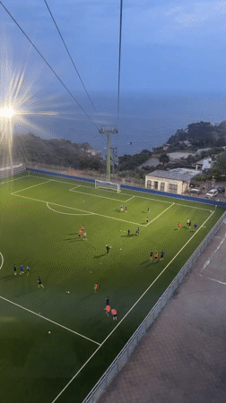 Evening soccer match observed from aerial view in Taormina
