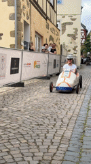 Soapbox derby racers compete on cobblestone streets in Meisenheim