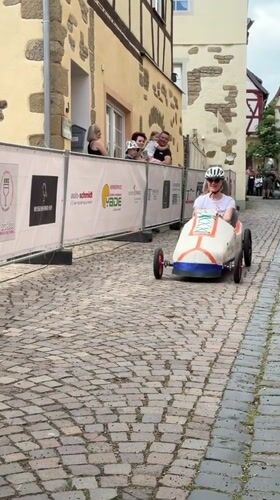Soapbox derby racers compete on cobblestone streets in Meisenheim