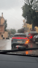 Midday rain disrupts daily life in Sant Feliu de Guíxols