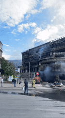 Fire-damaged building documented in Kyiv morning aftermath