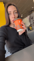 Woman enjoys breakfast at Saint Petersburg fast-food restaurant