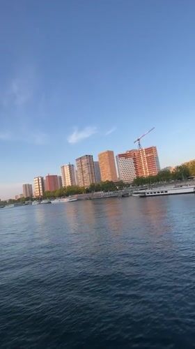 Calm evening on the Seine, fishing and bikes near the Eiffel Tower