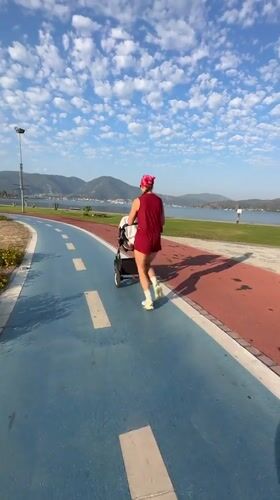 Jogging with a stroller along Fethiye's colorful park path