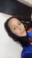 Woman records mirror selfies in blue athletic wear in Porlamar
