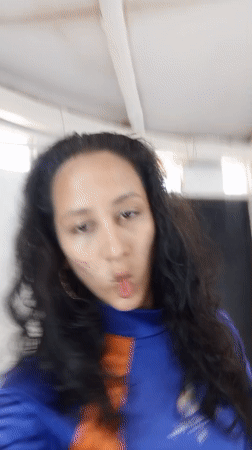 Woman records mirror selfies in blue athletic wear in Porlamar