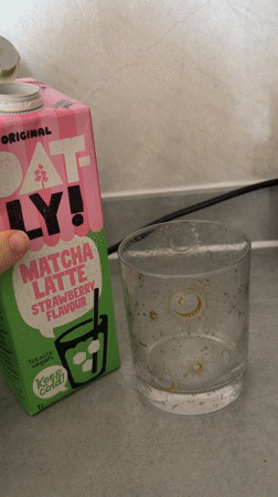 Oatly matcha strawberry drink poured into celestial glass in London