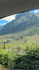 Mountain range filmed from car window in Cape Town