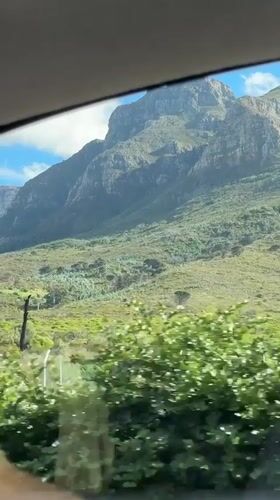 Mountain range filmed from car window in Cape Town