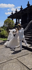 Wedding photoshoot captured at stone building in Denpasar