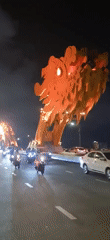 Dragon Bridge illuminated at night in Da Nang