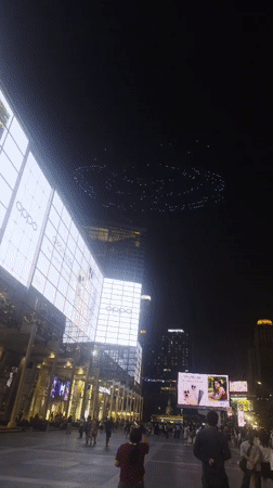 Drone light show spells "SKY EDGE" over Bangkok plaza
