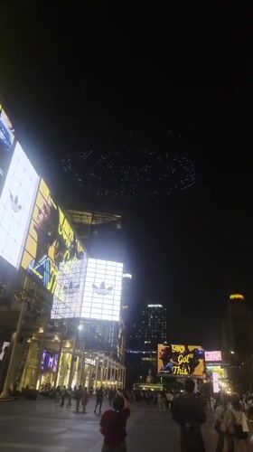 Drone light show spells "SKY EDGE" over Bangkok plaza